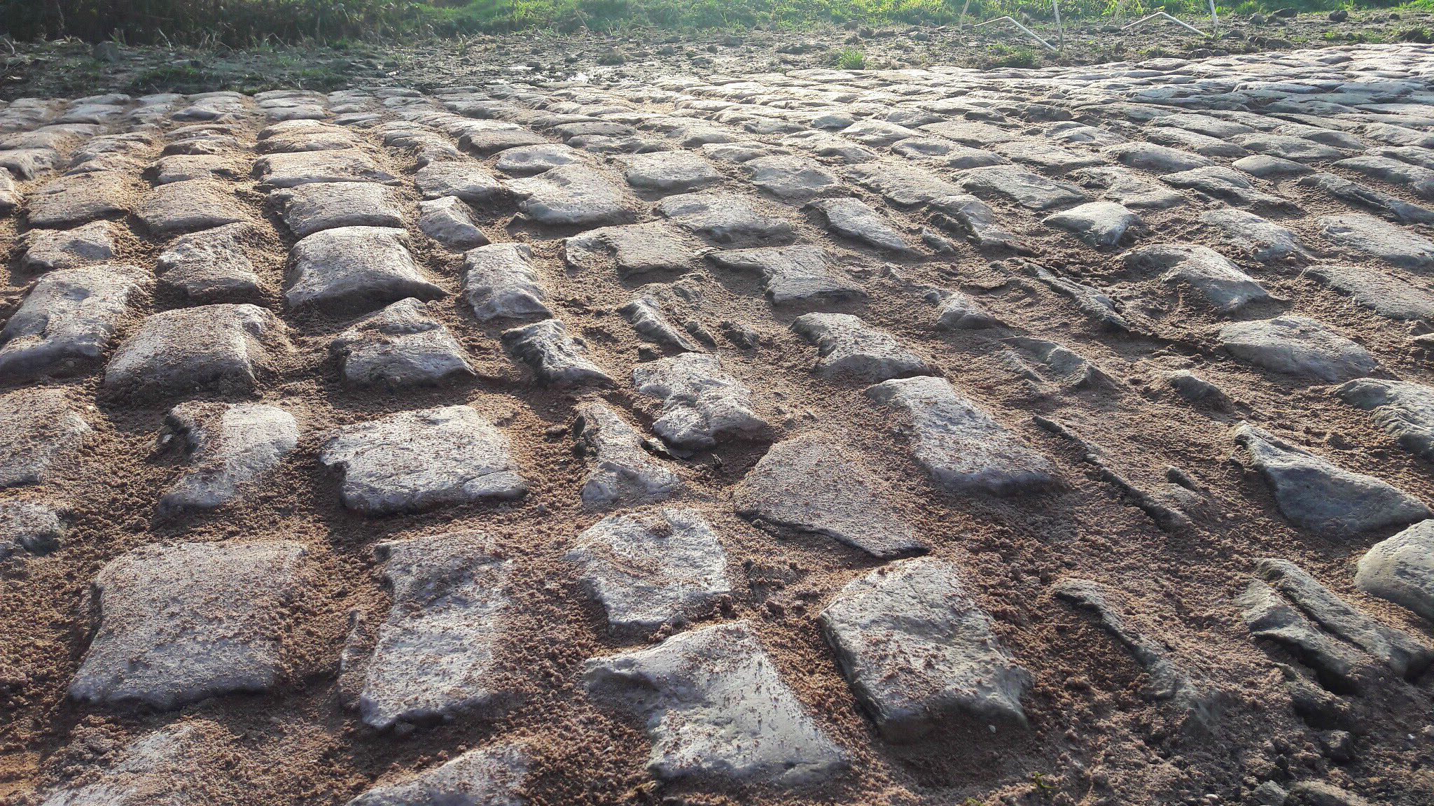 Imagine riding a road bike over these ancient bone-rattling stones on the Paris Roubaix course